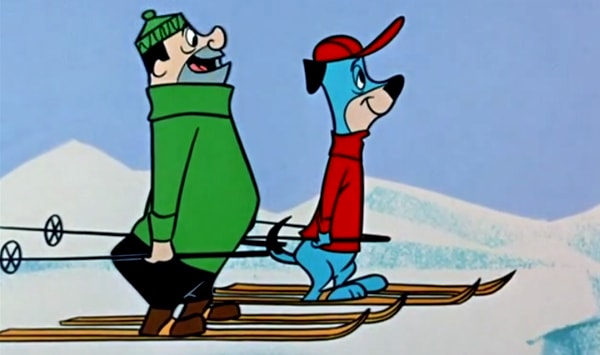 Huckleberry skiing with man