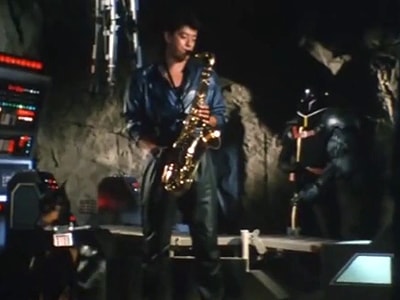 Ryusei playing sax in cave base