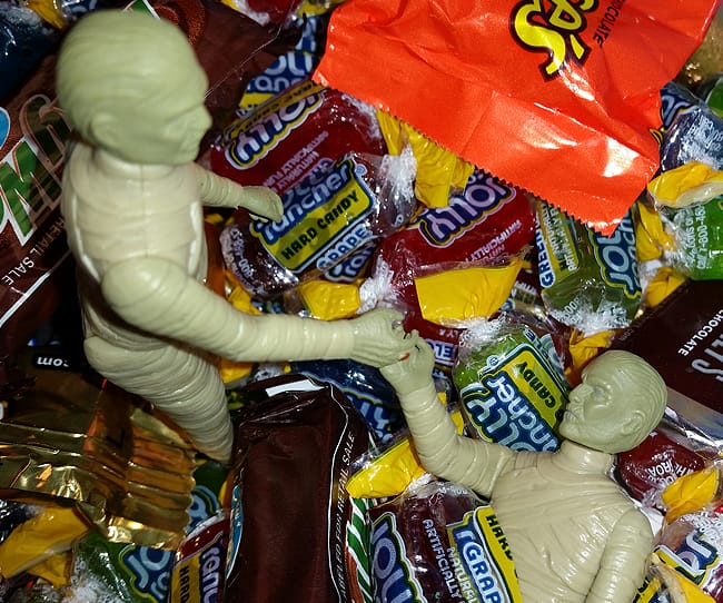 Mummy rescuing brother from candy pit