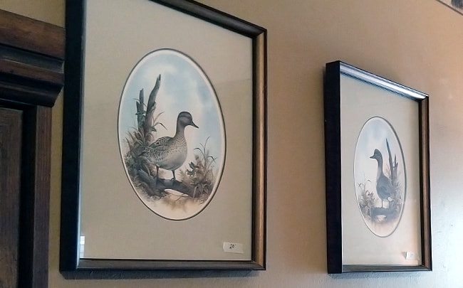 Pair of duck paintings on wall
