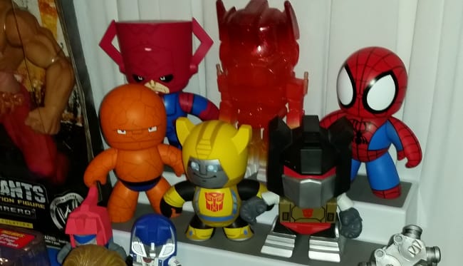 Cutesy superhero and Transformers figures