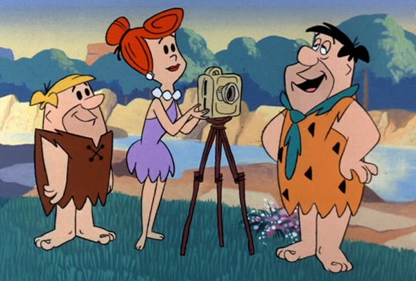 Wilma setting up photo with Fred and Barney
