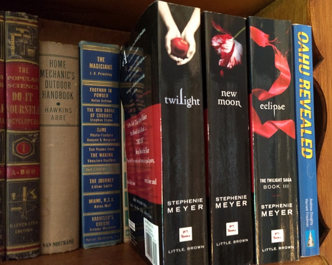 Three Twilight books on shelf